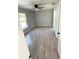 Bright bedroom features modern ceiling fan and wood-look tile flooring at 4919 Nw 61St Ct, Ocala, FL 34482