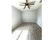 Clean view of bedroom space showing wood look tile floors, updated paint and ceiling fan at 4919 Nw 61St Ct, Ocala, FL 34482