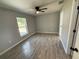Bright bedroom features modern ceiling fan and wood-look tile flooring at 4919 Nw 61St Ct, Ocala, FL 34482