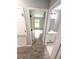 Hallway view shows bedroom and bathroom featuring the same paint, tile, and fixtures at 4919 Nw 61St Ct, Ocala, FL 34482