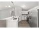 Bright kitchen features stainless steel appliances and white cabinetry at 4919 Nw 61St Ct, Ocala, FL 34482
