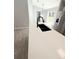 Kitchen island with white countertop and modern black faucet at 4919 Nw 61St Ct, Ocala, FL 34482