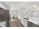 Spacious kitchen with modern appliances and views into the living area at 4919 Nw 61St Ct, Ocala, FL 34482