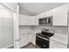 Efficient kitchen with stainless steel oven and modern microwave at 4919 Nw 61St Ct, Ocala, FL 34482