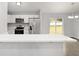 The kitchen features modern appliances and bar seating at 4919 Nw 61St Ct, Ocala, FL 34482