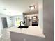 Kitchen with a center island, stainless steel appliances, and open access to the living area at 4919 Nw 61St Ct, Ocala, FL 34482