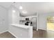 The kitchen features modern appliances, a breakfast bar and stainless steel refrigerator at 4919 Nw 61St Ct, Ocala, FL 34482