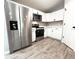 Modern kitchen with stainless steel appliances, white cabinets, and stylish countertops at 4919 Nw 61St Ct, Ocala, FL 34482