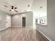 Open-concept living space with new floors, high ceilings, and modern kitchen at 4919 Nw 61St Ct, Ocala, FL 34482