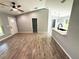 Living space with new wood-look tile, open floor plan, and natural light at 4919 Nw 61St Ct, Ocala, FL 34482
