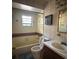 A bathroom featuring vintage elements such as a tub, toilet, and vanity at 4981 Lake Cecile Dr, Kissimmee, FL 34746