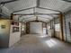 Interior view of metal building featuring an open space with abundant natural light from multiple windows at 4981 Lake Cecile Dr, Kissimmee, FL 34746