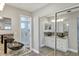 Dual sink bathroom with modern fixtures, decorative backsplash, and a glass-enclosed shower, creating a spa-like retreat at 5039 Jamaica # 10, Orlando, FL 32808