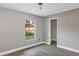 Bedroom with wood-look flooring, neutral walls, and a closet at 5039 Jamaica # 10, Orlando, FL 32808