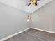 Bedroom featuring wood-look floors, a ceiling fan, and a small window at 5039 Jamaica # 10, Orlando, FL 32808