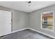Cozy bedroom featuring neutral walls, wood-look floors, and a window at 5039 Jamaica # 10, Orlando, FL 32808