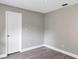 Bright bedroom with wood-look flooring and neutral paint at 5039 Jamaica # 10, Orlando, FL 32808