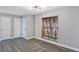 Bright living room with gray walls, new laminate flooring, and natural light at 5039 Jamaica # 10, Orlando, FL 32808