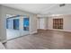 Spacious living room with wood-look floors and views of the outdoor pool area at 5039 Jamaica # 10, Orlando, FL 32808