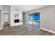 Open living room with a fireplace and sliding glass doors opening to the pool area at 5039 Jamaica # 10, Orlando, FL 32808
