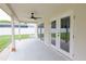A covered patio provides shade and has a ceiling fan, with views of the spacious backyard at 508 Key Ct, Orlando, FL 32828