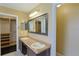 Bathroom with double sinks, a large mirror, and a view into the walk-in closet at 508 Key Ct, Orlando, FL 32828