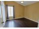 Hardwood bedroom featuring a window with curtains and a ceiling light for a cozy atmosphere at 508 Key Ct, Orlando, FL 32828