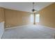Spacious carpeted bedroom with vaulted ceiling and double windows offering plenty of natural light at 508 Key Ct, Orlando, FL 32828