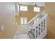 Inviting foyer with staircase, tile and carpet flooring, and natural light from the windows at 508 Key Ct, Orlando, FL 32828