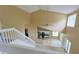 Bright foyer showcasing the staircase, kitchen, and patio doors, highlighting the home's layout at 508 Key Ct, Orlando, FL 32828