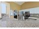 The updated kitchen features stainless steel appliances, granite countertops, and decorative backsplash at 508 Key Ct, Orlando, FL 32828