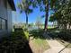 Picturesque backyard view with a serene lake and well-maintained green space at 51 Windtree Ln # 101, Winter Garden, FL 34787