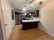 Modern kitchen with stainless steel appliances and granite countertops at 51 Windtree Ln # 101, Winter Garden, FL 34787