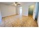 Spacious main bedroom with tile flooring, ceiling fan, and an ensuite bathroom at 51 Windtree Ln # 101, Winter Garden, FL 34787