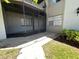 Enclosed back patio with concrete flooring, offering a private outdoor space at 51 Windtree Ln # 101, Winter Garden, FL 34787