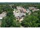 A bird's eye view of a grand residence featuring expansive windows, a spacious lot, and mature landscaping at 5852 Medinah Way, Orlando, FL 32819