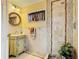 Bathroom featuring mosaic tile accents, decorative vanity, and shower at 5852 Medinah Way, Orlando, FL 32819