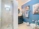 Updated bathroom featuring a tiled shower and antique vanity cabinet with lots of storage at 5852 Medinah Way, Orlando, FL 32819