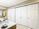 Bathroom with a double vanity and extensive closet space at 5852 Medinah Way, Orlando, FL 32819