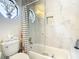 Bright bathroom exhibiting stylish tile work, glass shower enclosure, and modern fixtures providing a luxurious experience at 5852 Medinah Way, Orlando, FL 32819