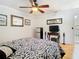 Relaxing bedroom boasting neutral decor, a ceiling fan, and comforting bedspread creates a tranquil retreat at 5852 Medinah Way, Orlando, FL 32819