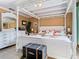 Comfortable bedroom features a canopy bed with tile floors, and custom side tables at 5852 Medinah Way, Orlando, FL 32819