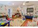 Large playroom exhibits hardwood flooring, mural, and abundant toys, perfect for an active and imaginative  at 5852 Medinah Way, Orlando, FL 32819