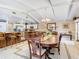 Dining room featuring a large dining table, chairs, and coffered ceilings at 5852 Medinah Way, Orlando, FL 32819