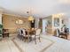 The dining room has neutral paint, tile flooring, and space for entertaining at 5852 Medinah Way, Orlando, FL 32819
