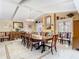 Elegant dining room featuring a fireplace and large wooden table perfect for gatherings at 5852 Medinah Way, Orlando, FL 32819