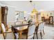 Dining area featuring hardwood furnishings, tile floors and custom lighting at 5852 Medinah Way, Orlando, FL 32819