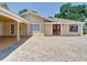 Charming home featuring a beautiful brick driveway, double door entry, and a covered carport at 5852 Medinah Way, Orlando, FL 32819