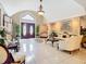 Elegant foyer with double doors, decorative tile, and high ceilings for a grand entrance at 5852 Medinah Way, Orlando, FL 32819