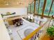 Bright living room with high ceilings, large windows and a full bar area at 5852 Medinah Way, Orlando, FL 32819